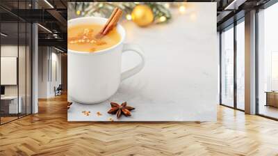 Hot cider in a mug with a cinnamon stick close up, cozy warmth, realistic, Fusion, kitchen counter Wall mural