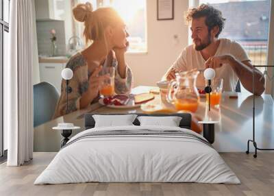 A young couple in love having romantic moments while having a breakfast at home. Relationship, love, together, breakfast Wall mural