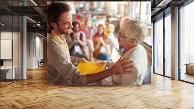 A young man thanks his female boss for getting company award Wall mural