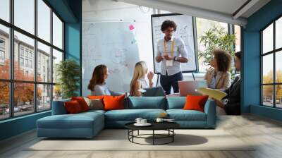 Business team and manager in meeting room.  business man afro-american explaining  analysis at the meeting. Wall mural