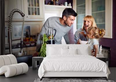 Family in kitchen having breakfast Wall mural