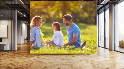 Family together in green nature Wall mural