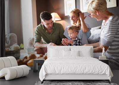 Family with cute child visiting grandma Wall mural