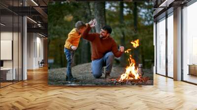 Father with son giving five Wall mural