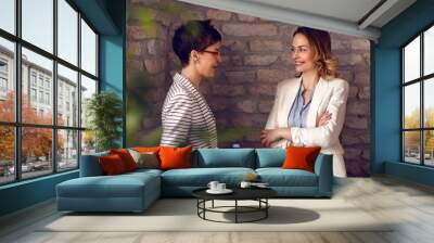 Females talking in office Wall mural