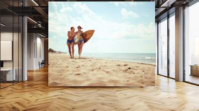 friend’s girls going to surfing. Healthy Active Lifestyle.. Wall mural