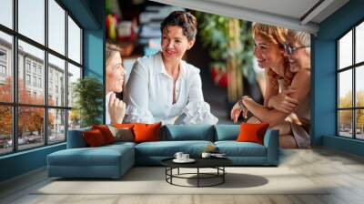 Group of cheerful business women chat during a break at workplace. Business, office, job Wall mural