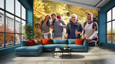 Group of people hiking in nature Wall mural