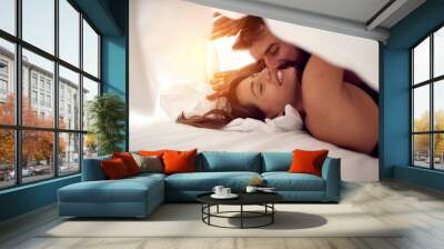 Happy couple having fun in bed. Wall mural