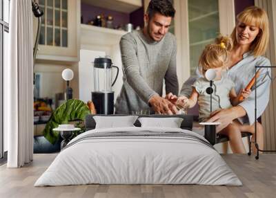 Happy family in kitchen making breakfast Wall mural