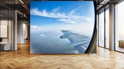 looking over aircraft wing in flight Wall mural