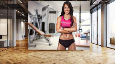 Portrait of sporty woman in gym Wall mural