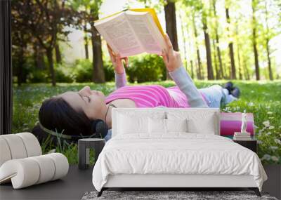 relaxing in nature with book and music Wall mural