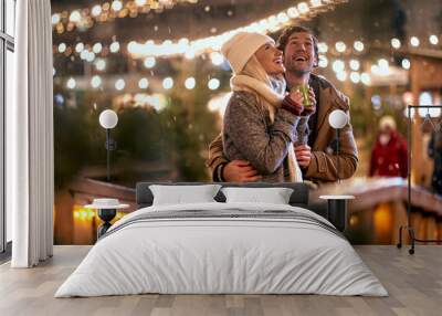 Romantic Christmas night.Man and woman outdoor in winter Wall mural