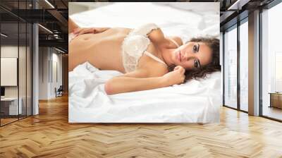 sexual girl lie on white sheet Wall mural