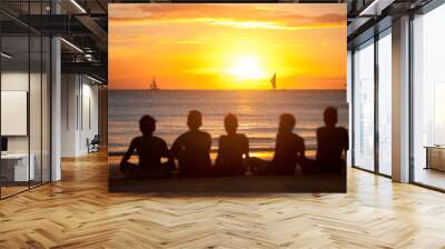 silhouette of group of friends in sunset Wall mural