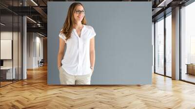 Smiling brunette posing Wall mural