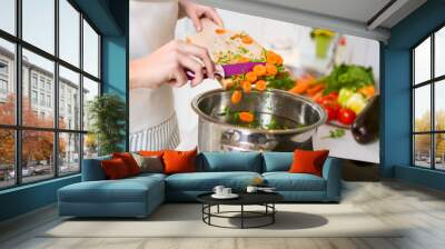 vegetables on the cutting board are falling in the pot Wall mural