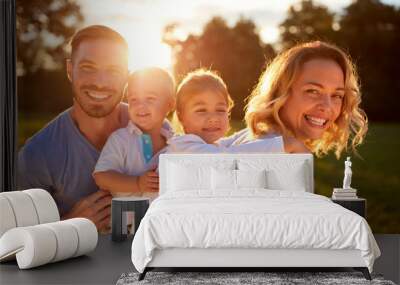 Wife and husband with children in nature Wall mural