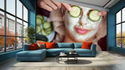 young girl with a mask for skin face Wall mural