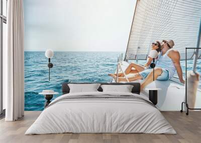 Young man and woman Relaxing on a Yacht.. Wall mural