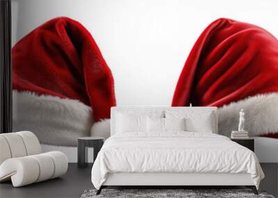 Collection of red santa hats isolated on white background Wall mural