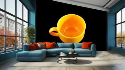 Big yellow cup on black with clipping path. Wall mural