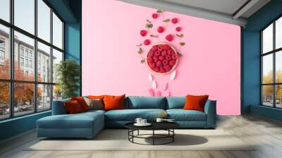 Creative summer background made from fresh berries and flowers on pink. Flat lay, copy space. Wall mural