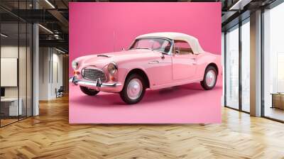 old pink car isolated on pink background Wall mural