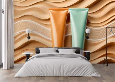 two unlabeled cosmetic tubes placed on a sandy background with wave patterns Wall mural