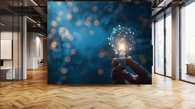 Hand holding glowing light bulb with digital network connections, representing innovation, creative thinking, and idea generation on a dark blue background. Perfect for technology, creativity Wall mural