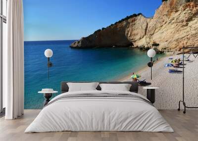 beautiful seascape background, umbrellas and sun loungers on the beach of Porto Katsiki on Lefkada Island. sea view, social distance on the beach Wall mural