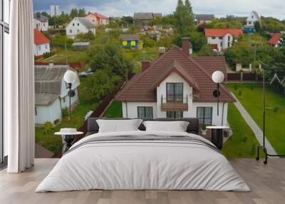 new house, the roof of which is made of metal. Cottage in the co Wall mural