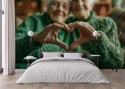 The elderly couple's love gesture. Wall mural