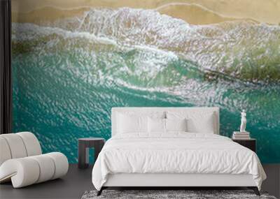 An aerial view of a tropical sandy beach and blue ocean. Wall mural