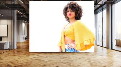 A portrait of a girl with afro hair in a yellow tropical style blouse Wall mural