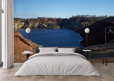 Contaminated pond lake of an old abandoned mine red landscape in Mina de Sao Domingos, Portugal Wall mural