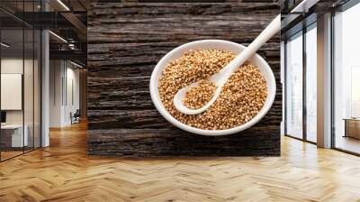 Amaranthus - Organic amaranth pops in the bowl and spoon. wooden background Wall mural