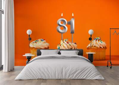 Birthday celebration in orange color - Candle number 81 Wall mural