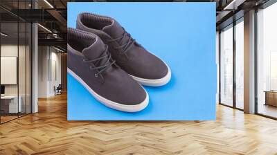 Shoe with white sole for man - Blue background. Wall mural