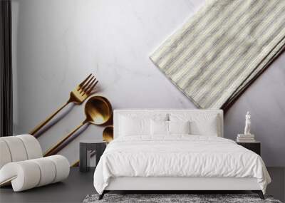 premium gold fork, knife and spoon with marble envelope and white and blue striped napkin Wall mural