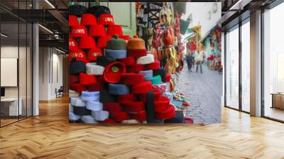 Closeup of a stack of hats in a bazaar in Tunis, Tunisia during daylight Wall mural