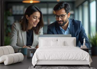 Indian financial advisors, both male and female, discuss a stock market strategy in a modern company using a laptop computer. Managers from South Asia Work Together on a Banking Project 
 Wall mural