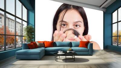 Hispanic teenage girl playing with crystal ball on white background. Mysticism concept Wall mural