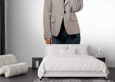 A full-length shot of a Young business woman thinking an idea while looking up over isolated white background Wall mural