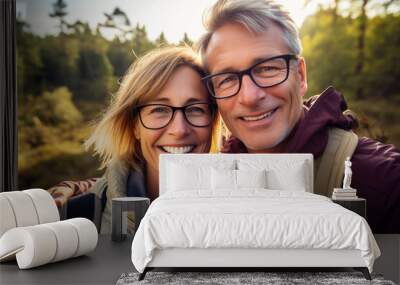 Adult couple at outdoors with glasses Wall mural