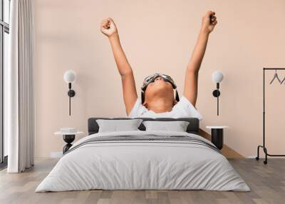 African American boy  with aviator hat and with wings over isolated background Wall mural