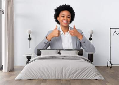 African american business woman over isolated white background giving a thumbs up gesture Wall mural