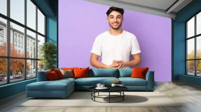 Arabian handsome man over isolated background laughing Wall mural