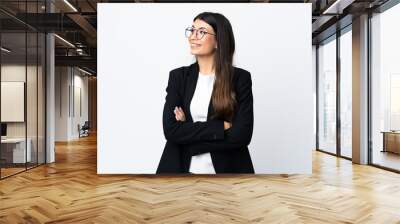 Business woman over isolated white background laughing Wall mural